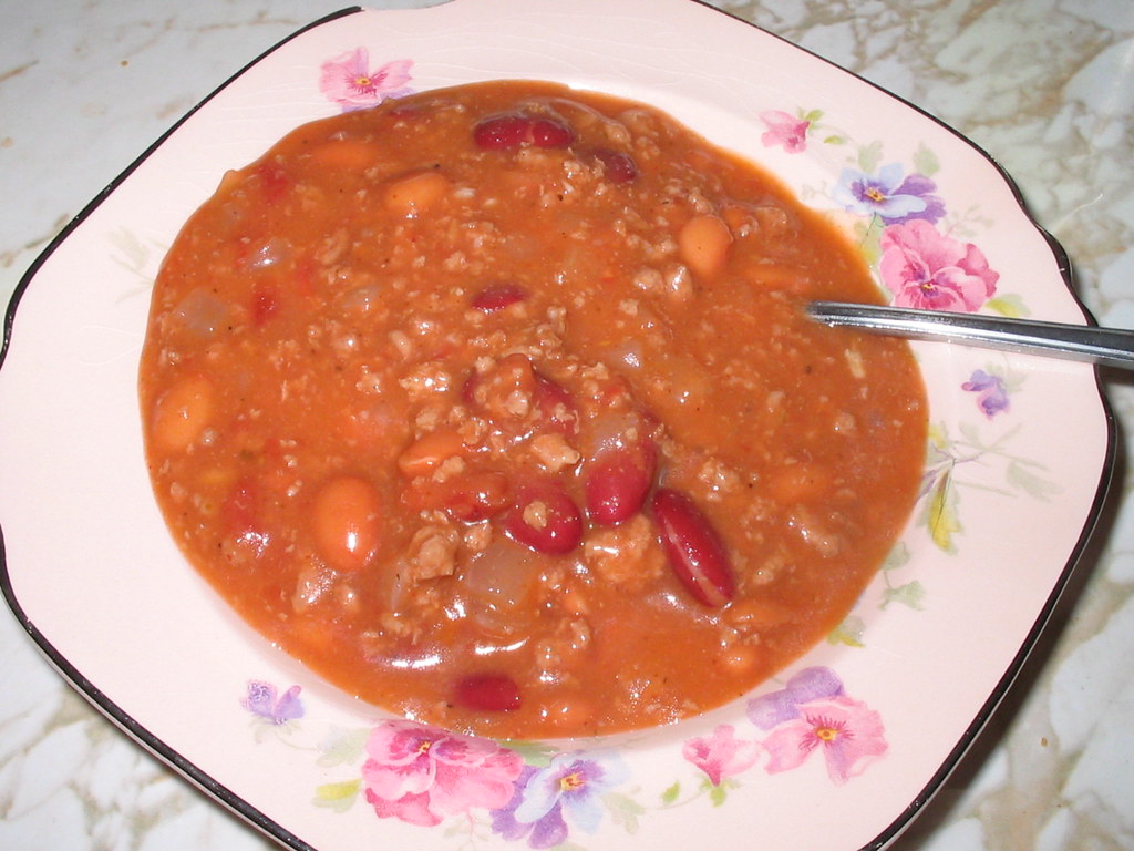 Bowl of turkey chili with kidney beans in a floral bowl