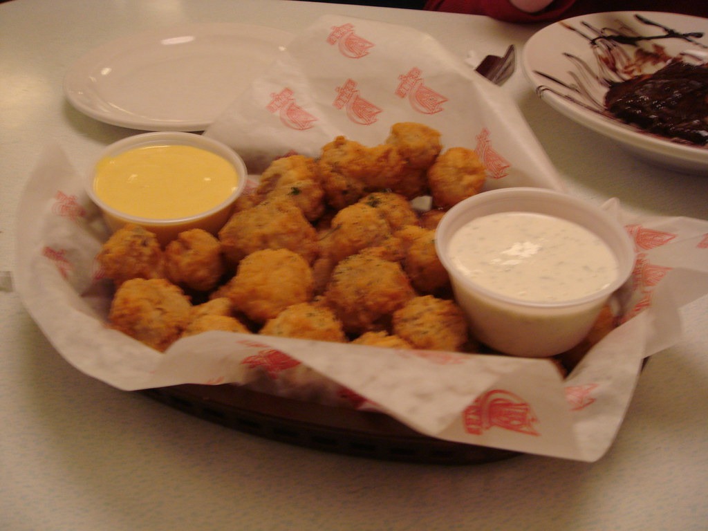 Crispy beer battered fried mushrooms with a dipping sauce