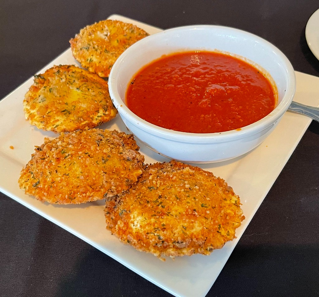 Golden fried cheese pieces with tomato salsa