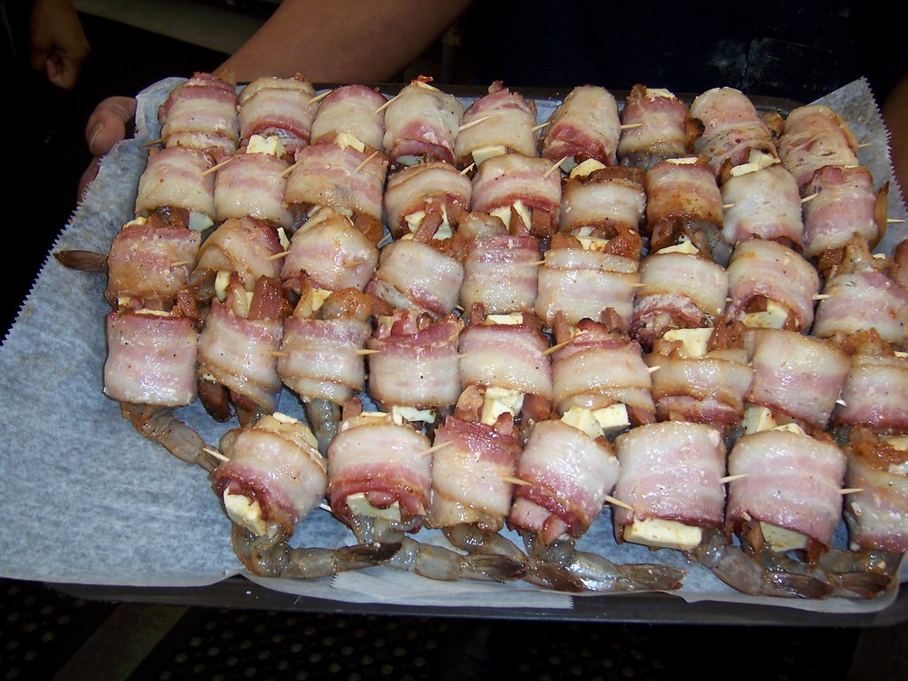 Bacon wrapped shrimp skewers glazed with barbecue sauce