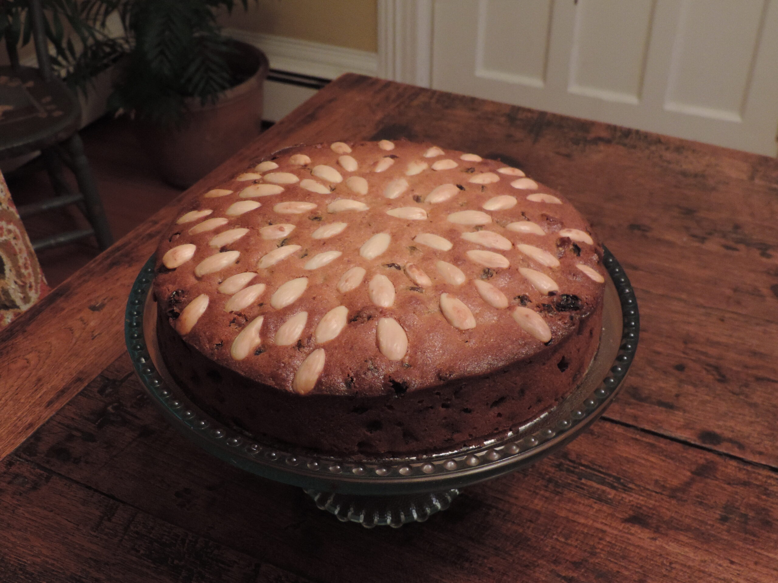 Scottish Dundee cake topped with circles of whole almonds
