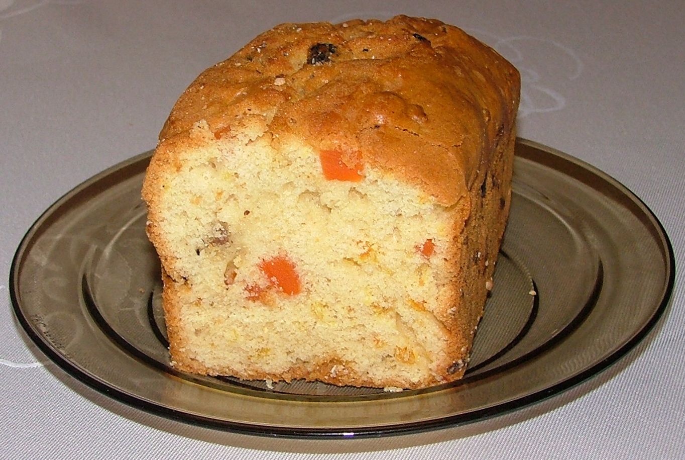 Light golden fruitcake loaf studded with candied fruit