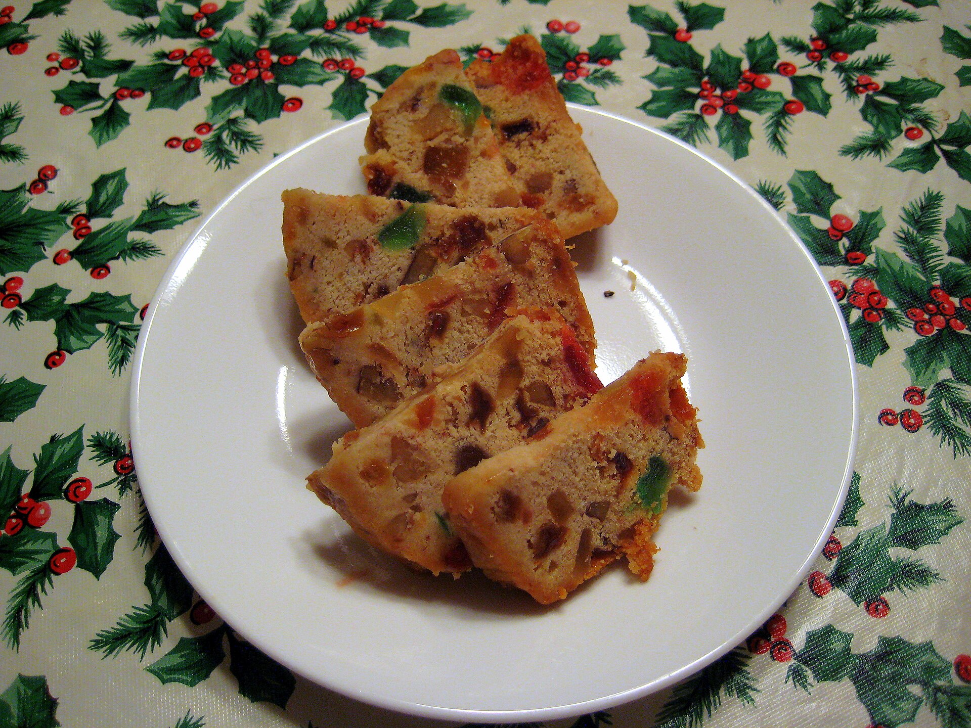 Slices of fruitcake on a plate ready to wrap and store