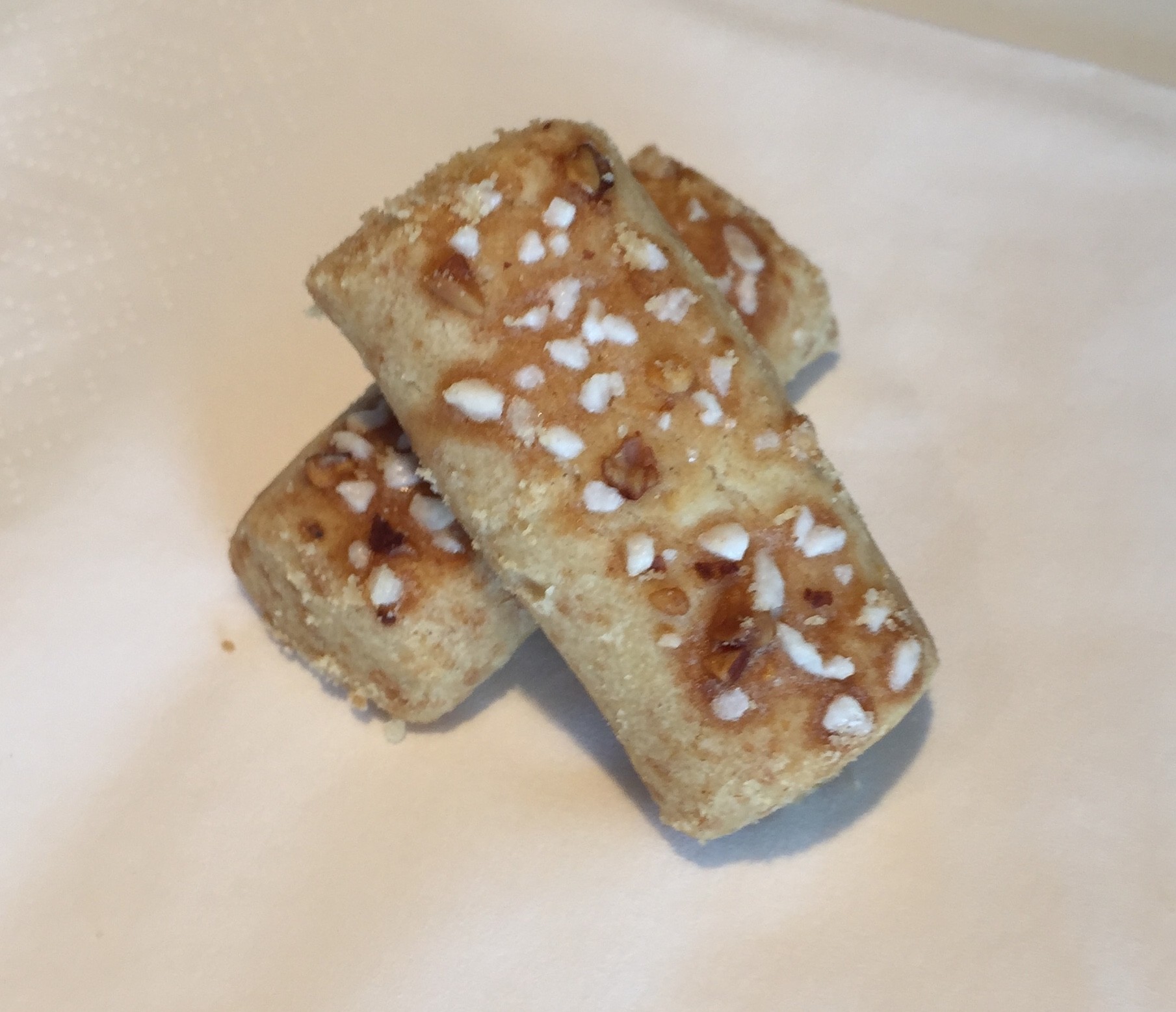 Two Swedish almond sticks topped with pearl sugar and chopped almonds