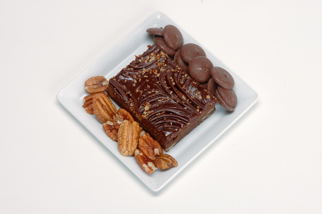 Chocolate pecan brownie square with whole pecans