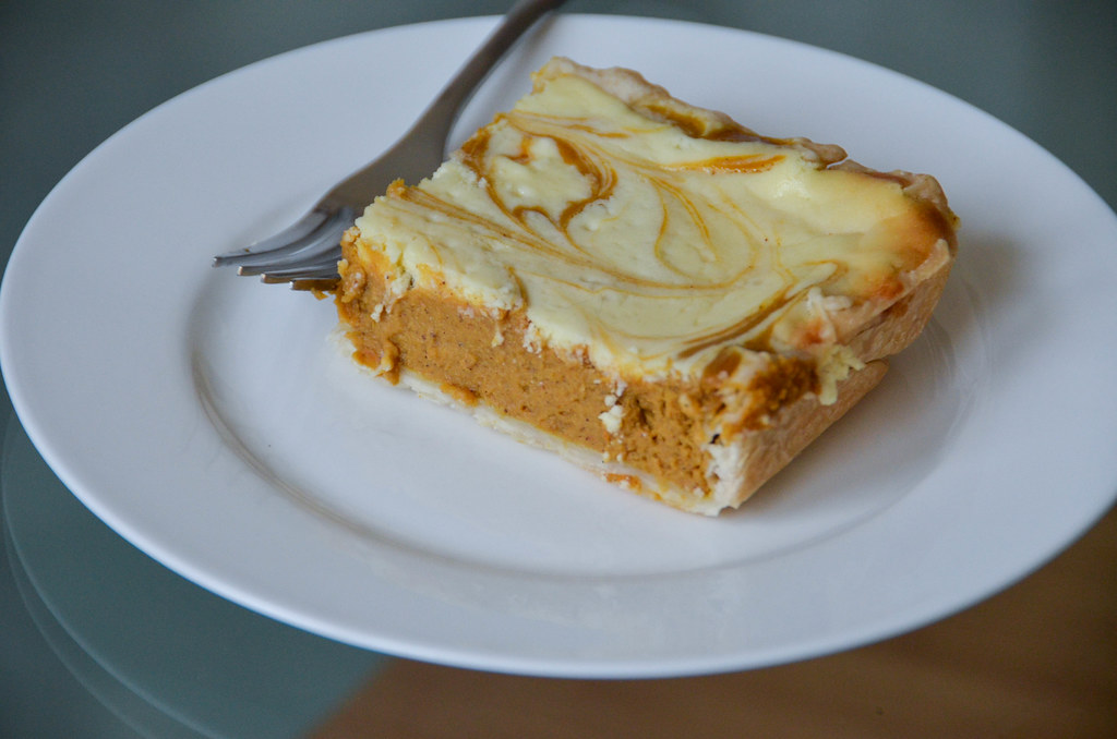 Marbled pumpkin cheesecake bar on a white plate