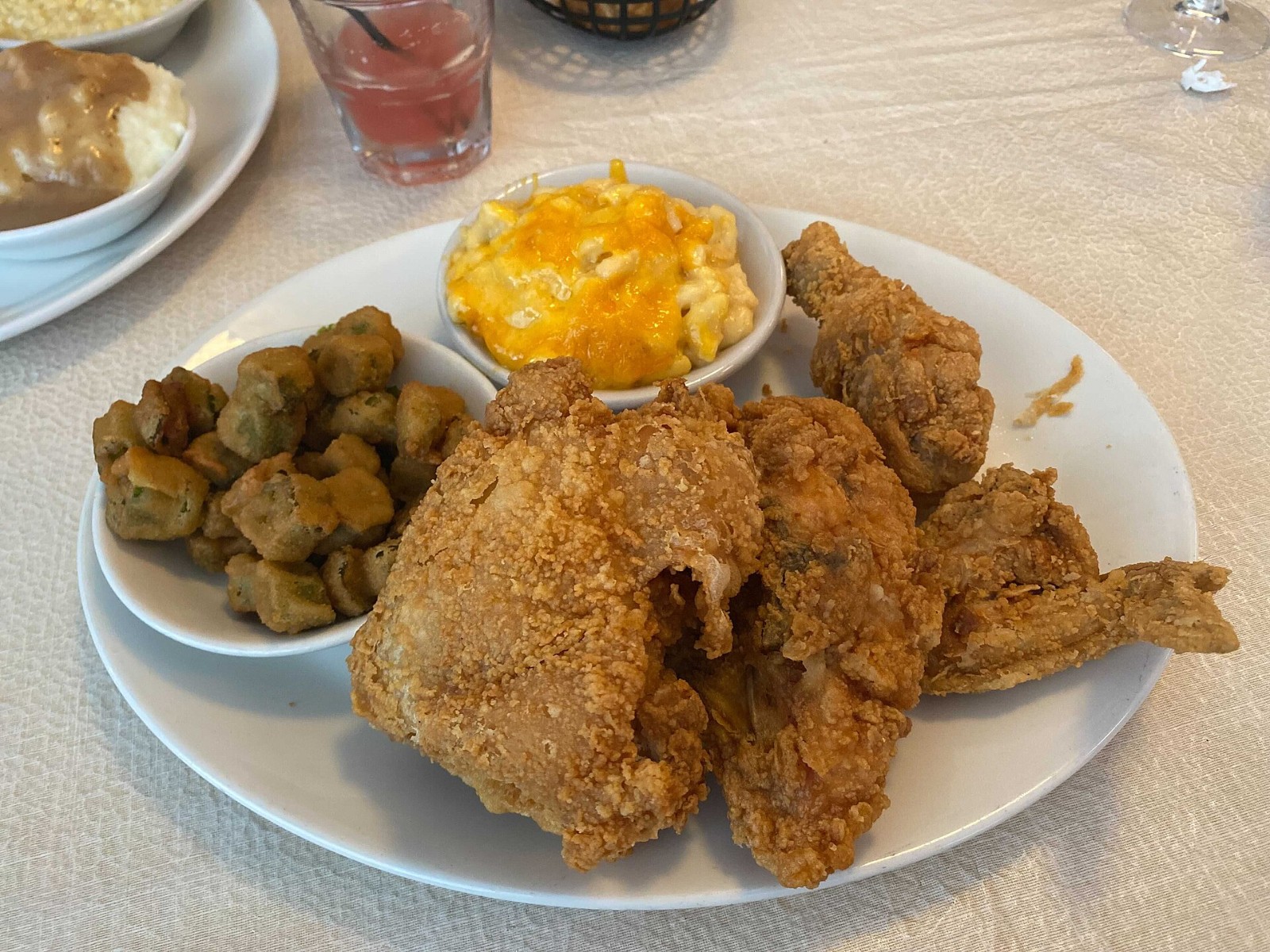 Crispy buttermilk fried chicken served with okra and mac and cheese