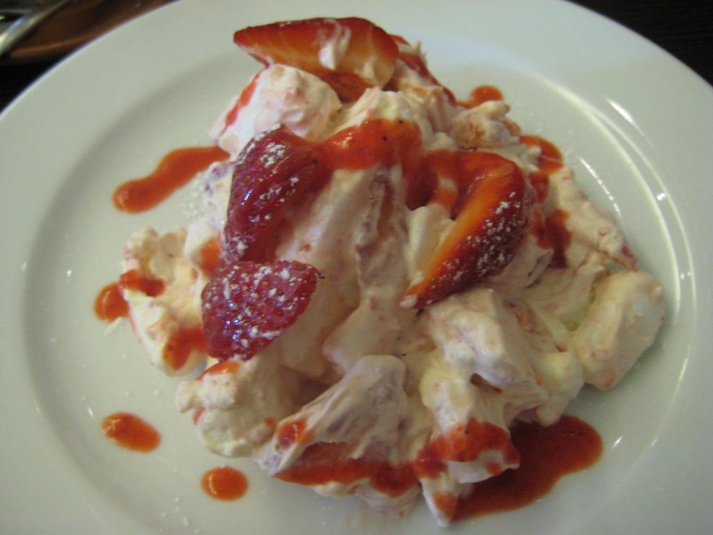 Eton mess dessert with strawberries, cream and meringue