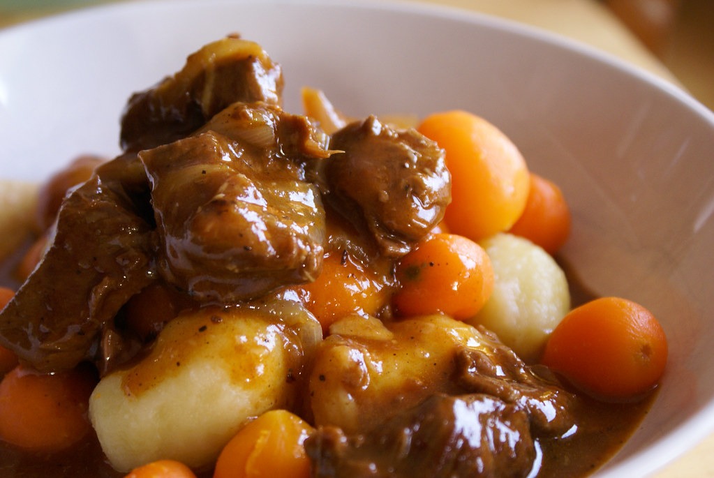 Snow day recipes bowl of hearty beef stew with carrots and potatoes