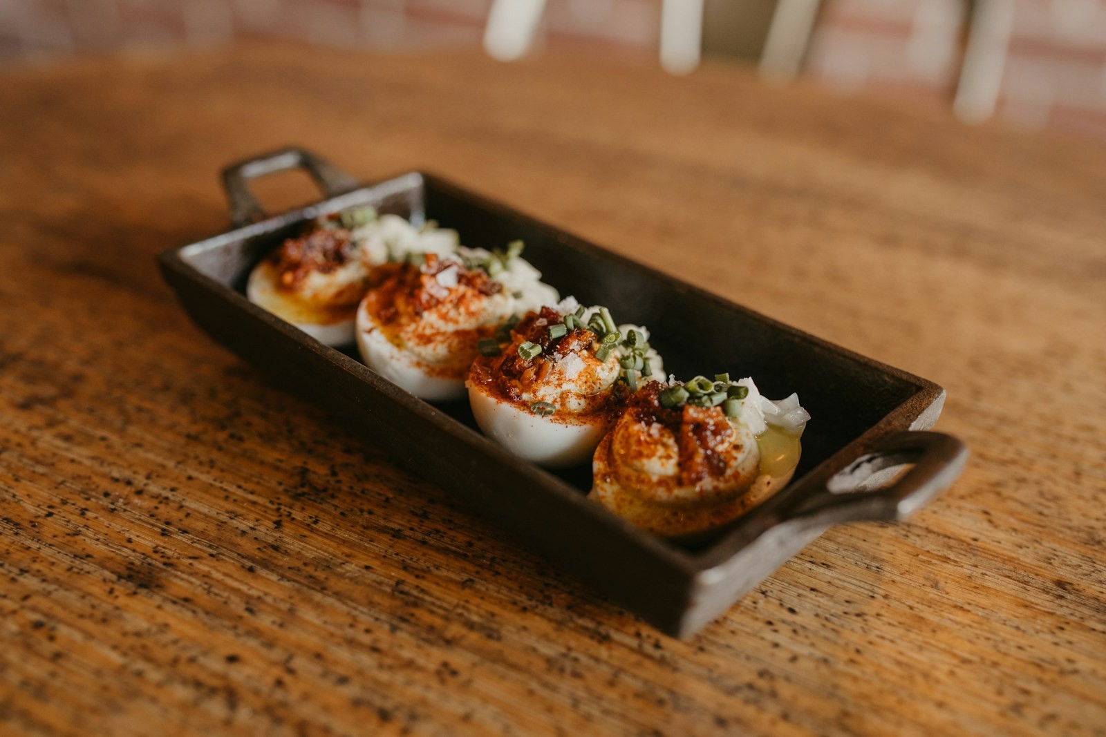 Deviled eggs topped with paprika, a classic among Chrissy Teigen recipes