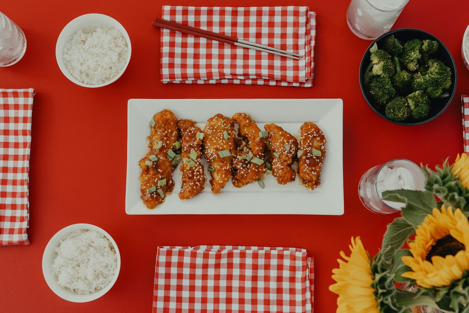 Garlic parmesan chicken bites on a white plate with dipping sauces