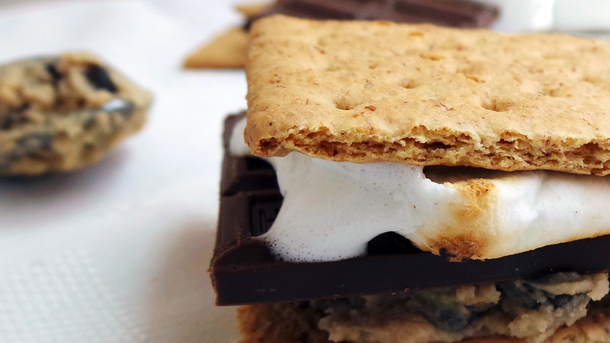 S'mores built on a chocolate chip cookie with dark chocolate and marshmallow