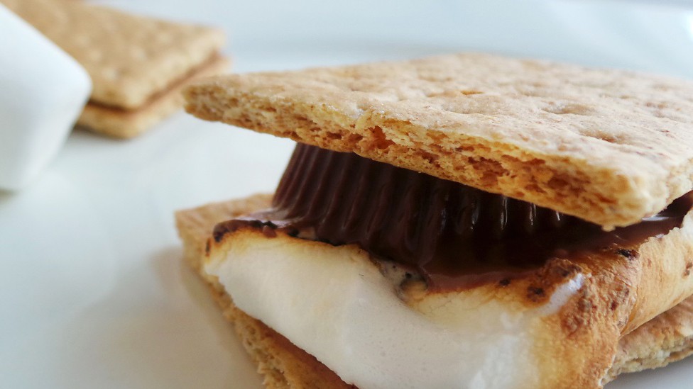 S'mores made with a peanut butter cup and a toasted marshmallow
