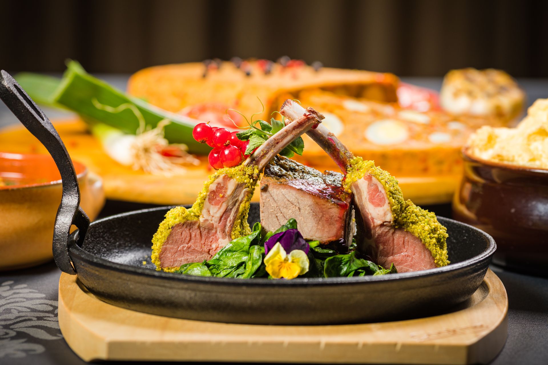 Christmas dinner for two: a small rack of lamb in a cast iron skillet