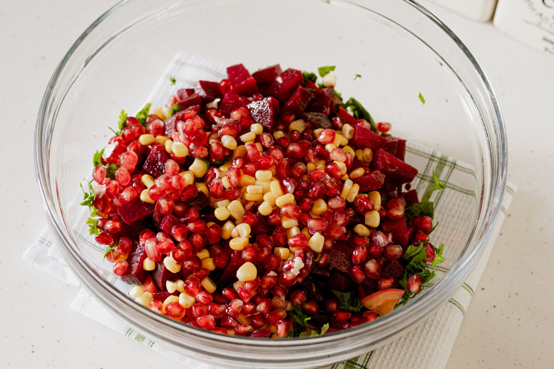 Christmas dinner for two side: beet and pomegranate salad in a glass bowl