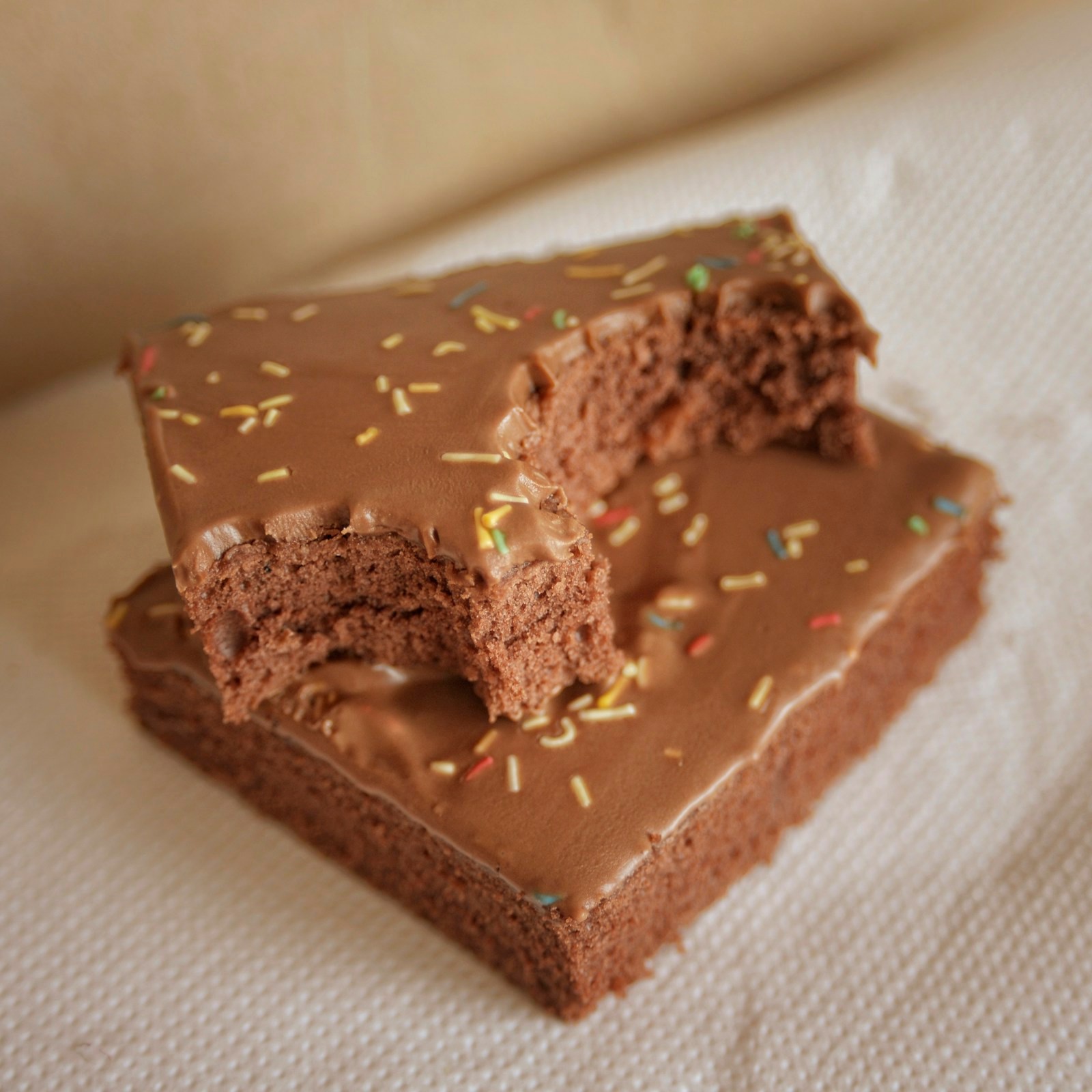 Chocolate fudge squares topped with colorful sprinkles