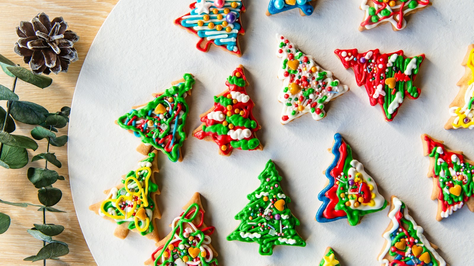Christmas tree cookies decorated with green icing and sprinkles