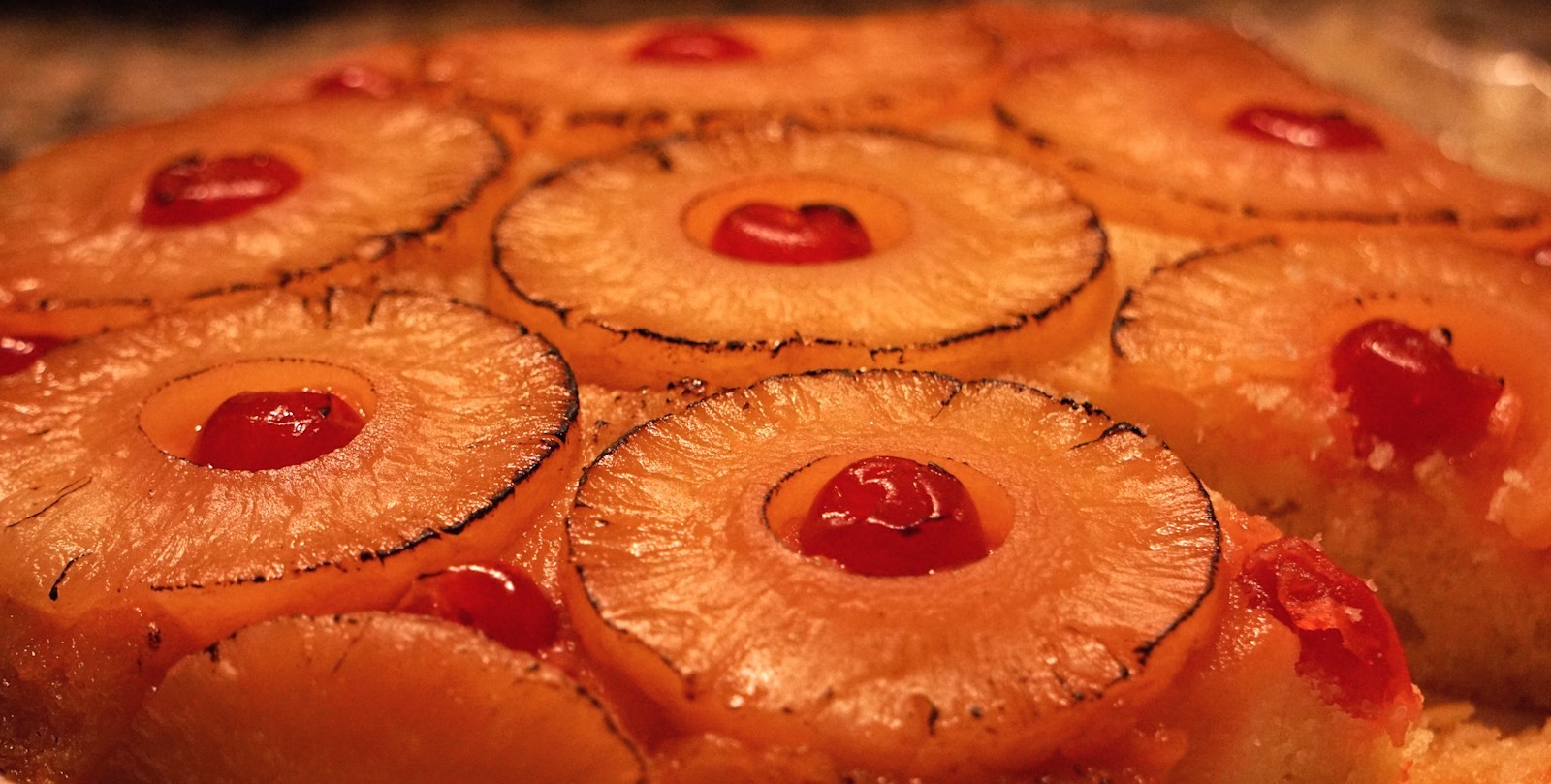 Pineapple upside-down cake with caramelized pineapple rings and cherries