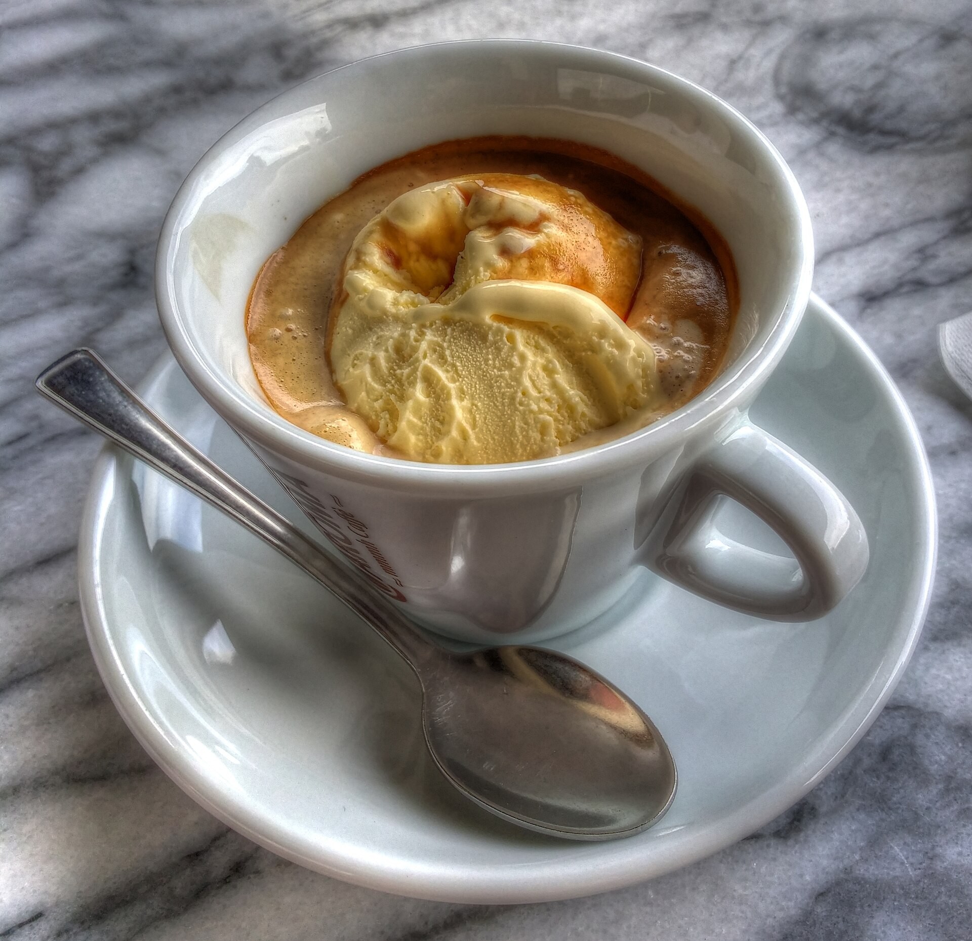 Christmas ice cream desserts affogato with espresso in a white cup