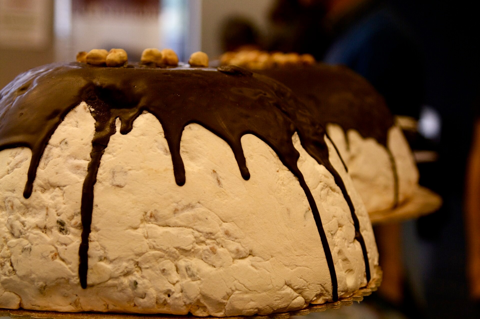 Italian zuccotto dome with chocolate drip and hazelnuts