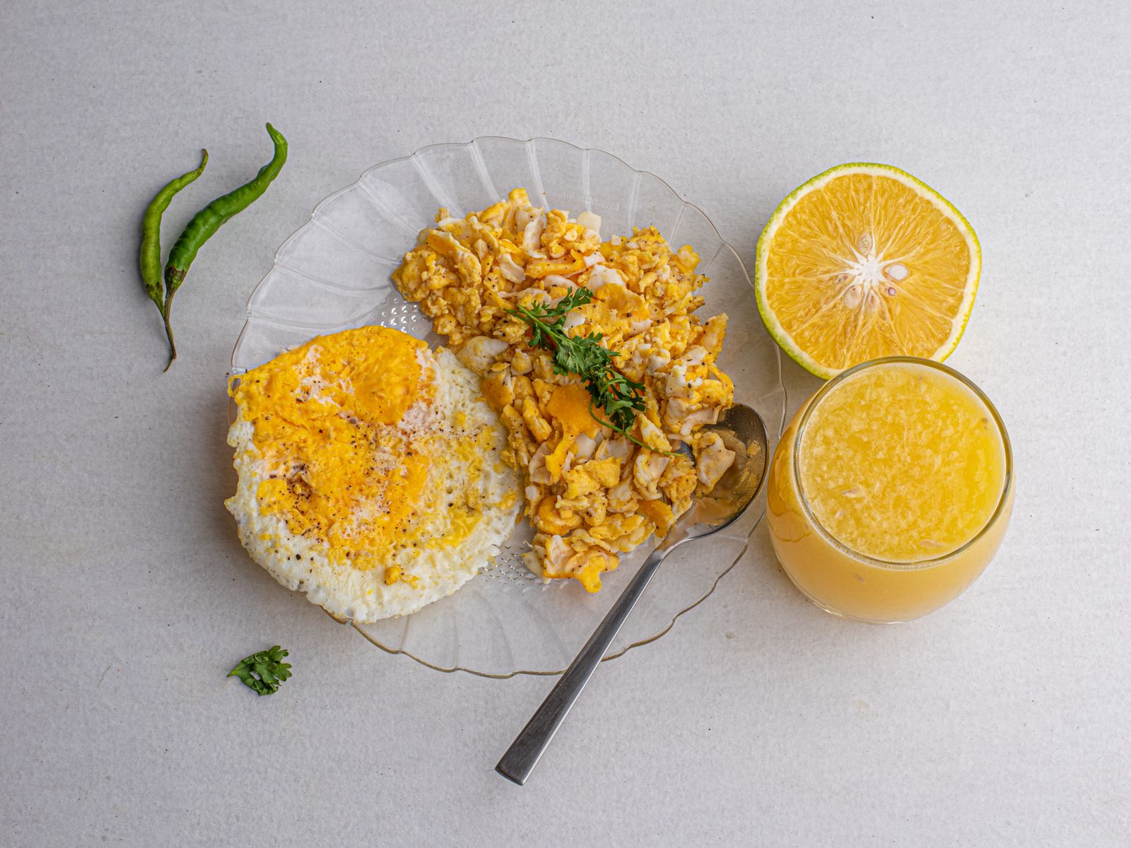 Soft food recipes: soft scrambled eggs on a glass plate with orange juice