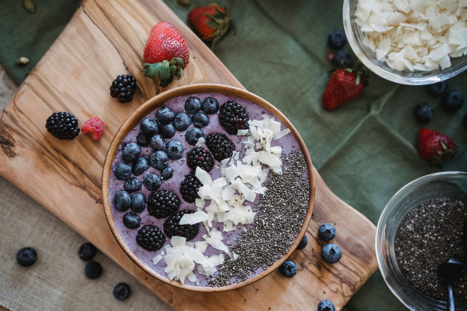 Berry smoothie bowl topped with coconut and blueberries